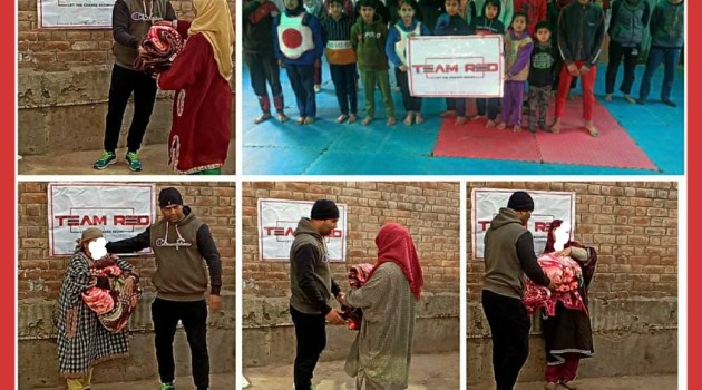 Team-Red blanket donation drive underway At Bandipora, Team Red’s District Co-Ordinator Fasil Ali leads drive.