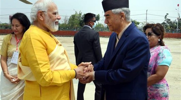 PM being welcomed by the Prime Minister of Nepal, Mr. Sher Bahadur Deuba, on his arrival in Lumbini, Nepal