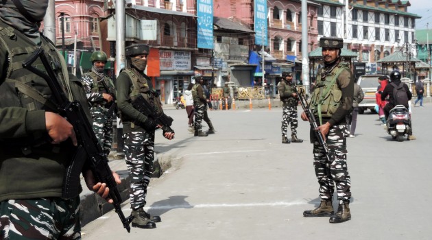  A CRPF jawan stand guard at historic Lal Chowk in Srinagar on Wednesday as security has been beefed up after recent militant attack