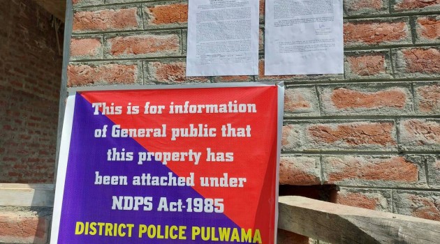 Police attach property of drug peddler in Pulwama