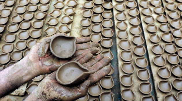 Kashmiri Potter busy on wheel making earthen lamps ahead of Diwali